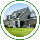 The exterior of a large, gray suburban home. 